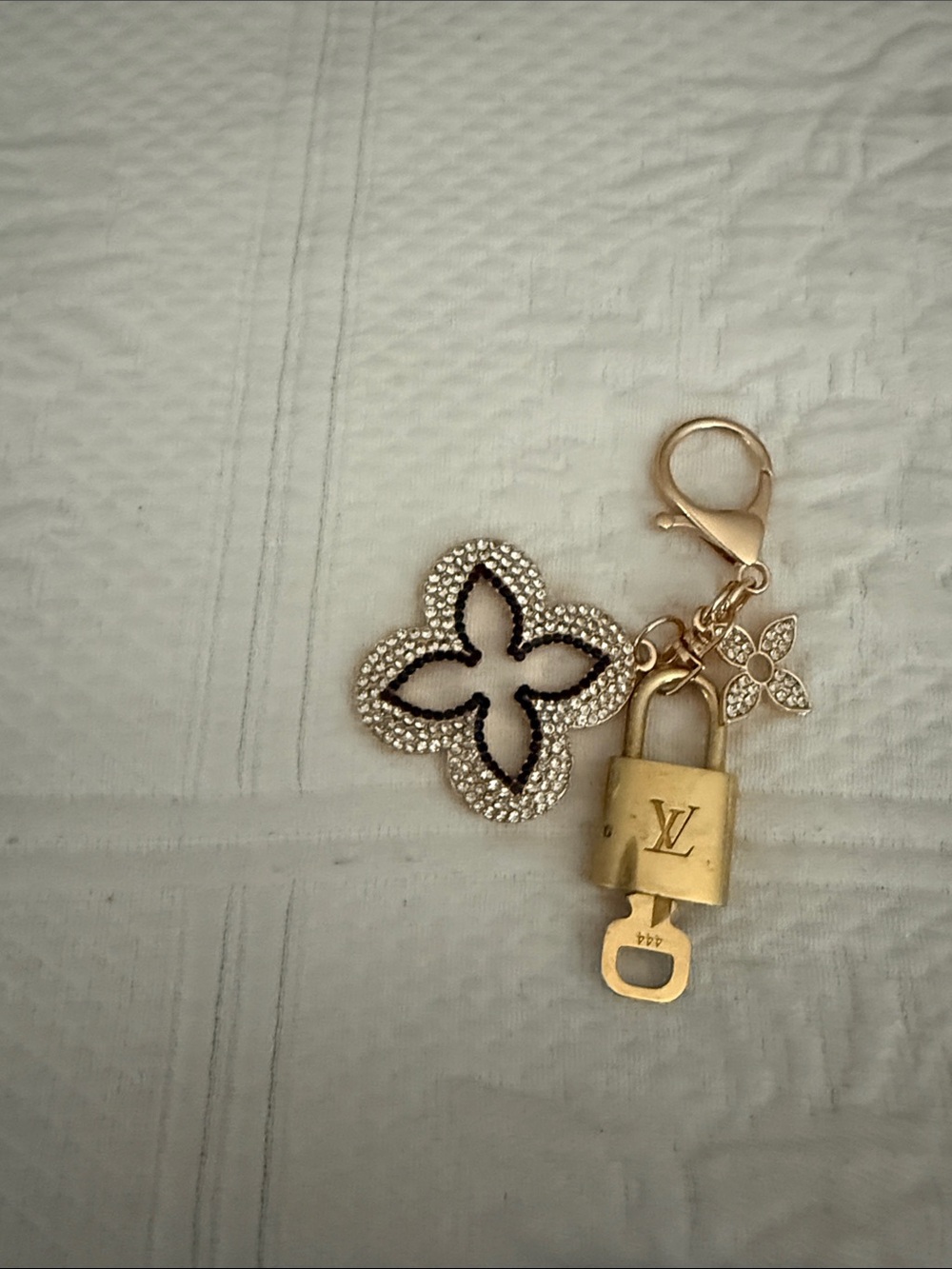 Louis Vuitton lock and key with unbranded gold and White Crystal Flower Charm